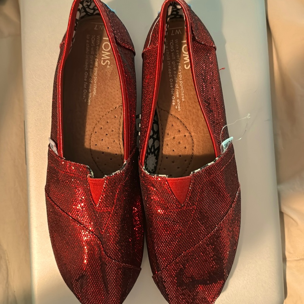 Tom’s ruby red glitter slip on.